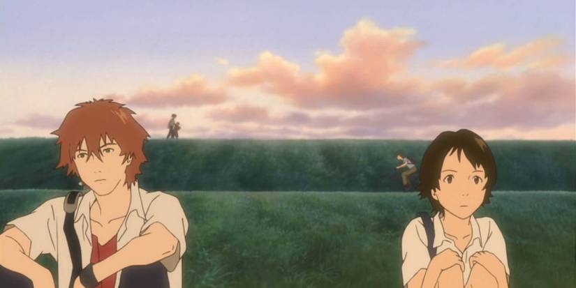 An image of Mirai and another character sitting on a grᴀssy hill in The Girl Who Leapt Through Time
