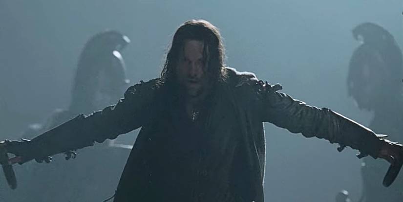 Viggo Mortensen as Aragorn bursting through the doors of helms deep in The Two Towers