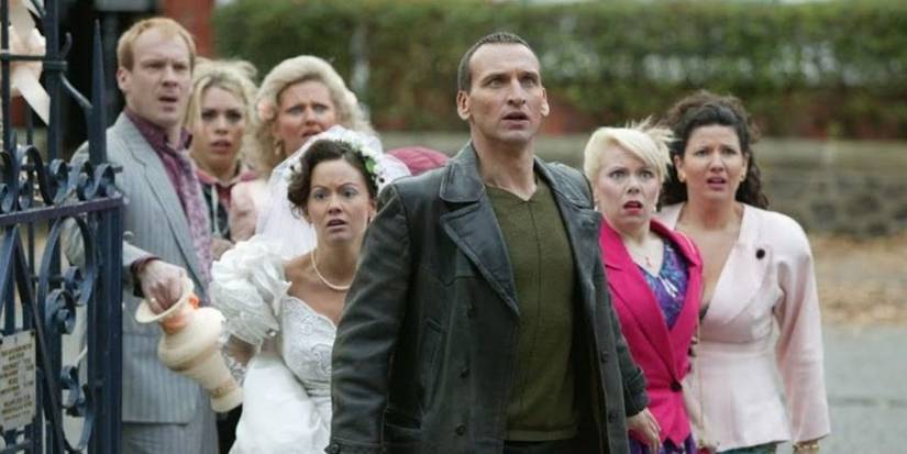 The Doctor leads the people into the church