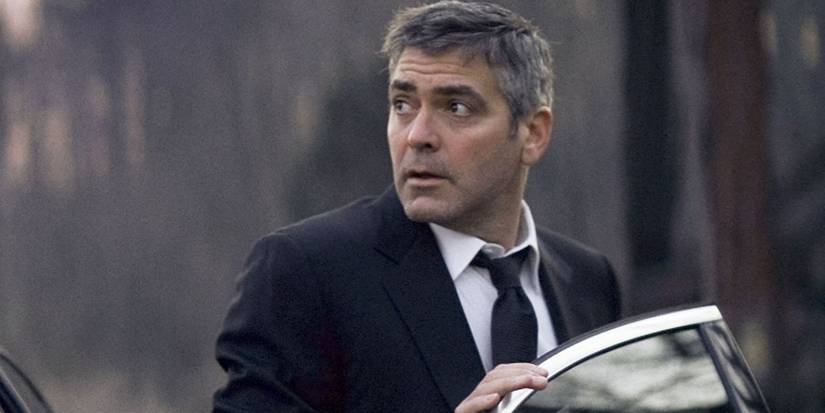 George Clooney looking surprised outside his car in Michael Clayton