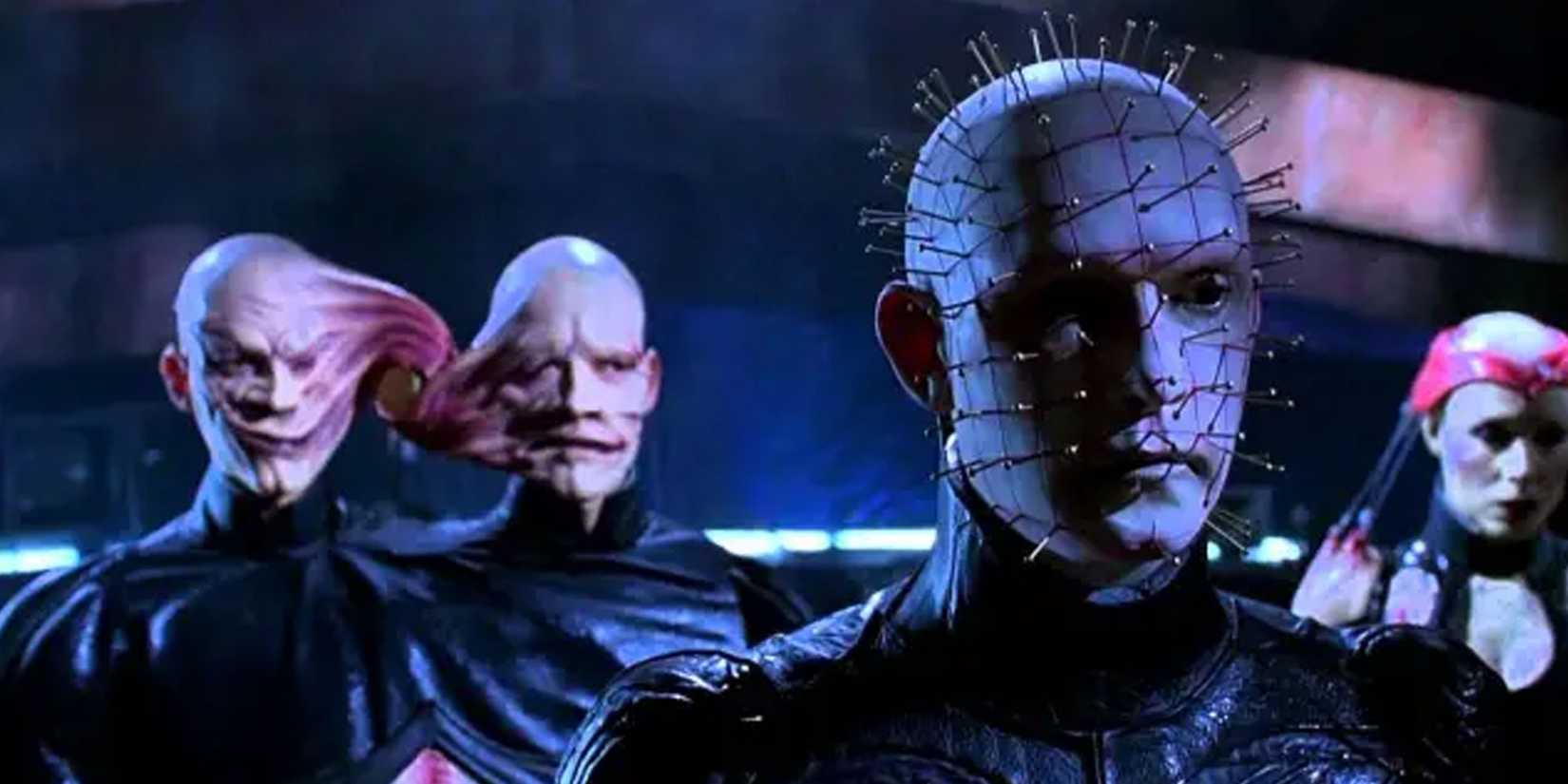 Pinhead looking forward with the conjoined twins and Angelique standing behind in Hellraiser Bloodline (1996)