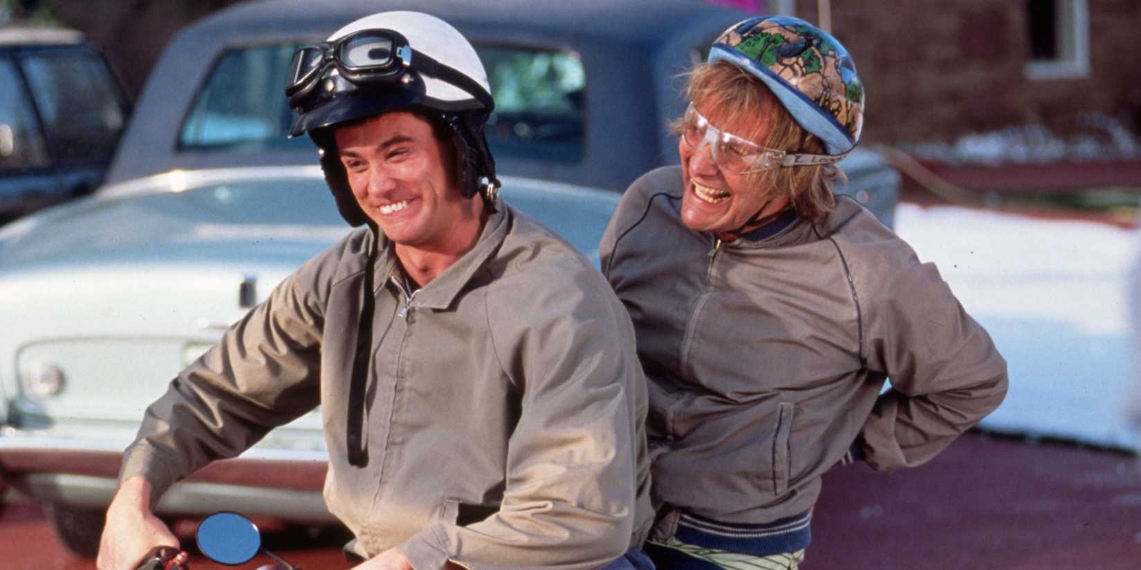 Lloyd (Jim Carrey) and Harry (Jeff Daniels) ride on a moped in Dumb and Dumber