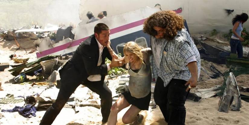Jack (Matthew Shephard) and Hurley (Jorge Garcia) help Claire (Emilie de Ravin) in front of the plane wreckage in Lost