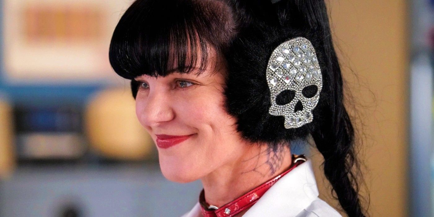 Pauley Perrette wears skull earmuffs and smiles as Abby Sciuto in NCIS