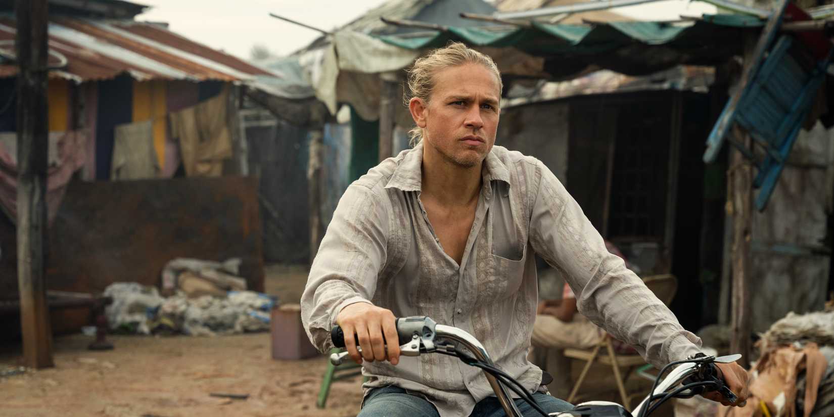 Charlie Hunnam’s Lin Ford in Apple TV’s Shantaram, riding a bike