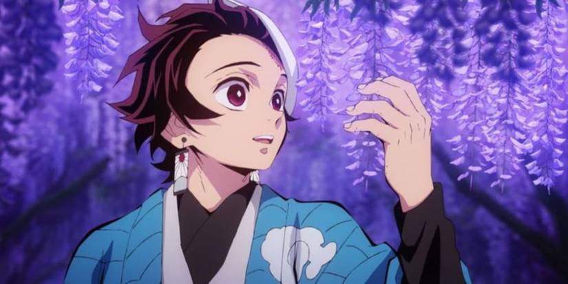 Tanjiro in a forest surrounded by vibrant purple leaves in Demon Slayer.