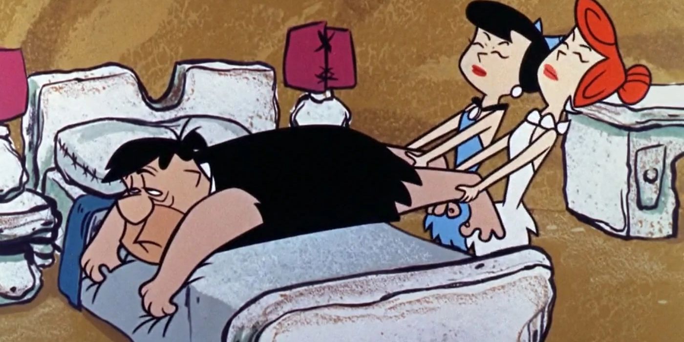 Os Flintstones: Wilma e Betty tentam puxar um Fred letárgico para fora da cama