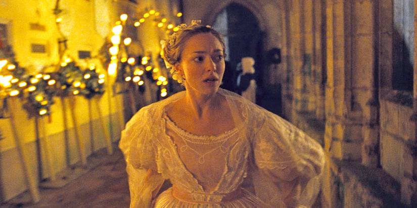Amanda Seyfried as Cosette singing and looking distressed in Les Miserable