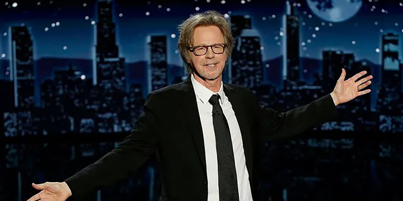 Dana Carvey, arms outstretched and smiling while hosting Jimmy Kimmel Live!