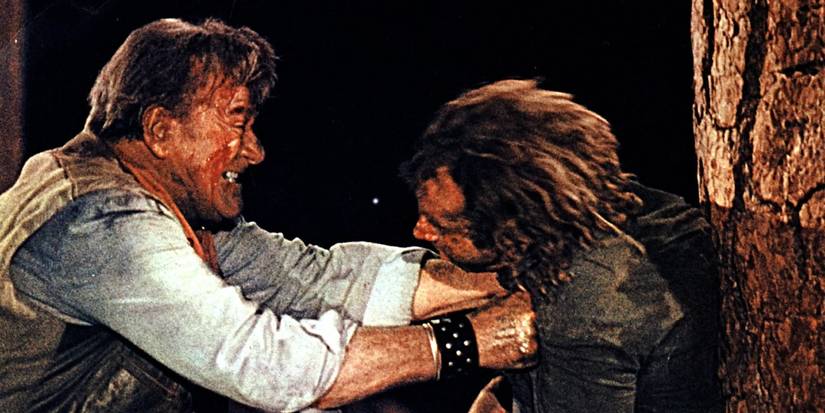 John Wayne e Bruce Dern em luta em The Cowboys.