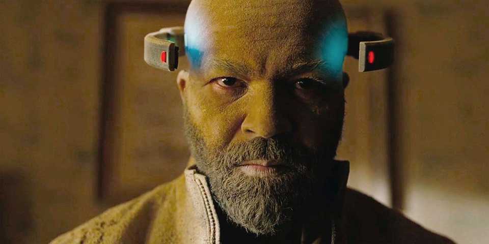 Bernard with dust all over him, with a machine on his head, in a scene from Westworld.