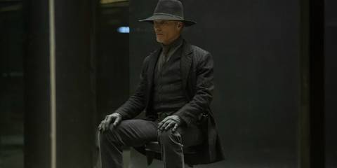 William, a.k.a. the Man in Black, sitting in a chair as his host version on Westworld.