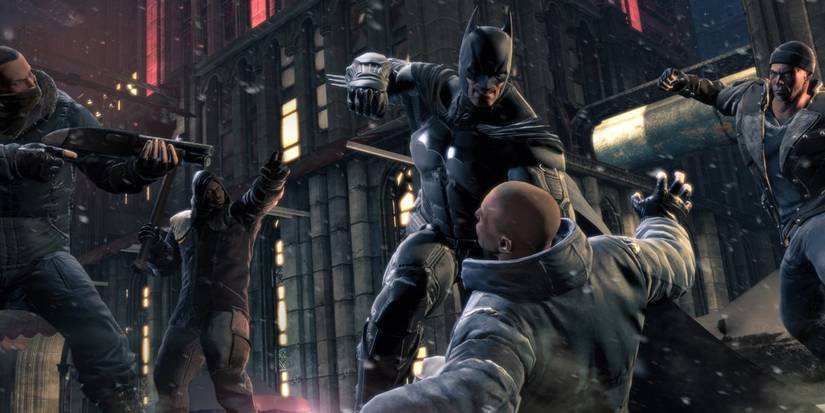 Batman lutando contra um grupo de bandidos nas origens de Arkham.