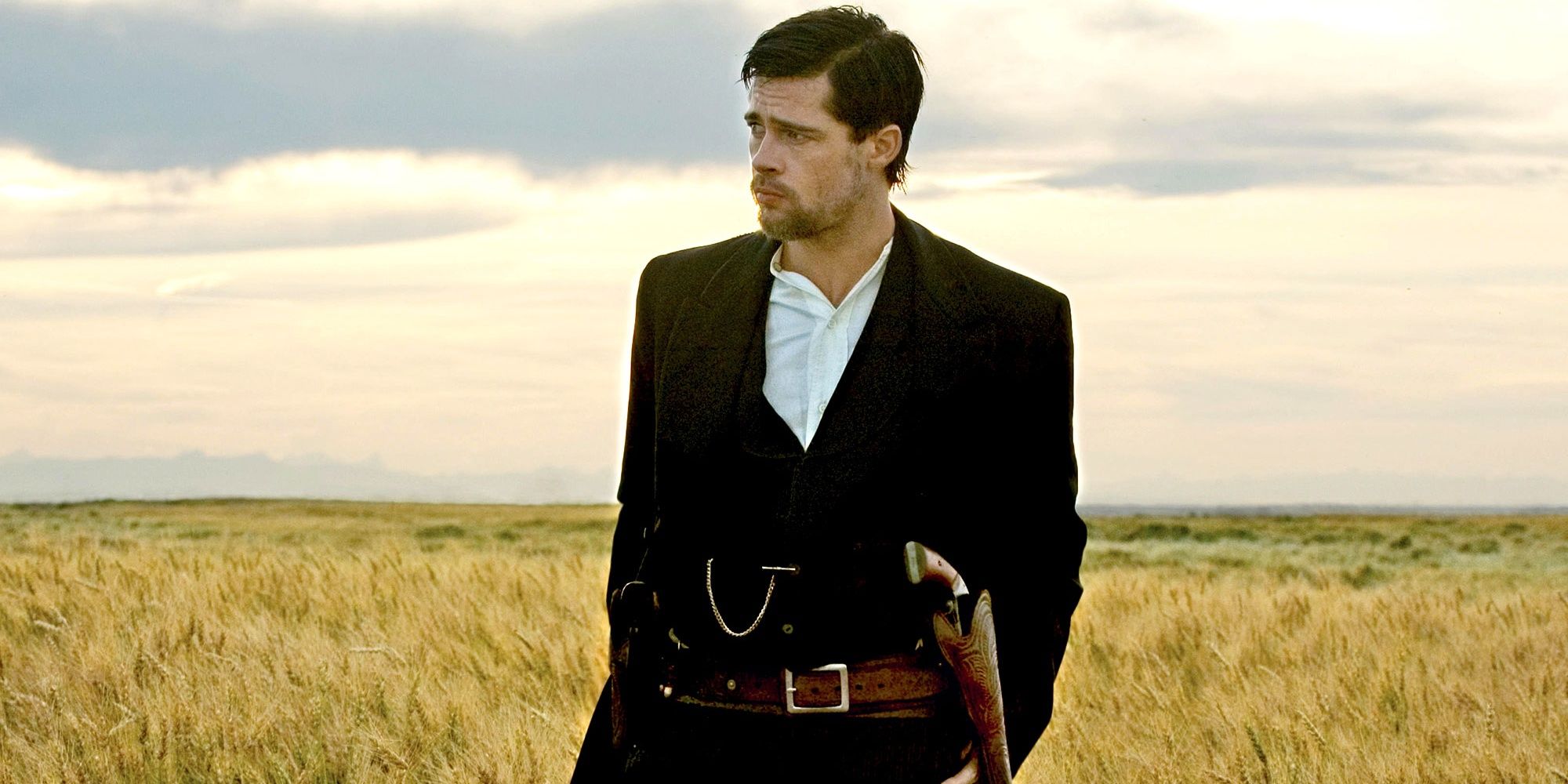 Brad Pitt stands in a field in The Assassination Of Jesse James By The Coward Robert Ford