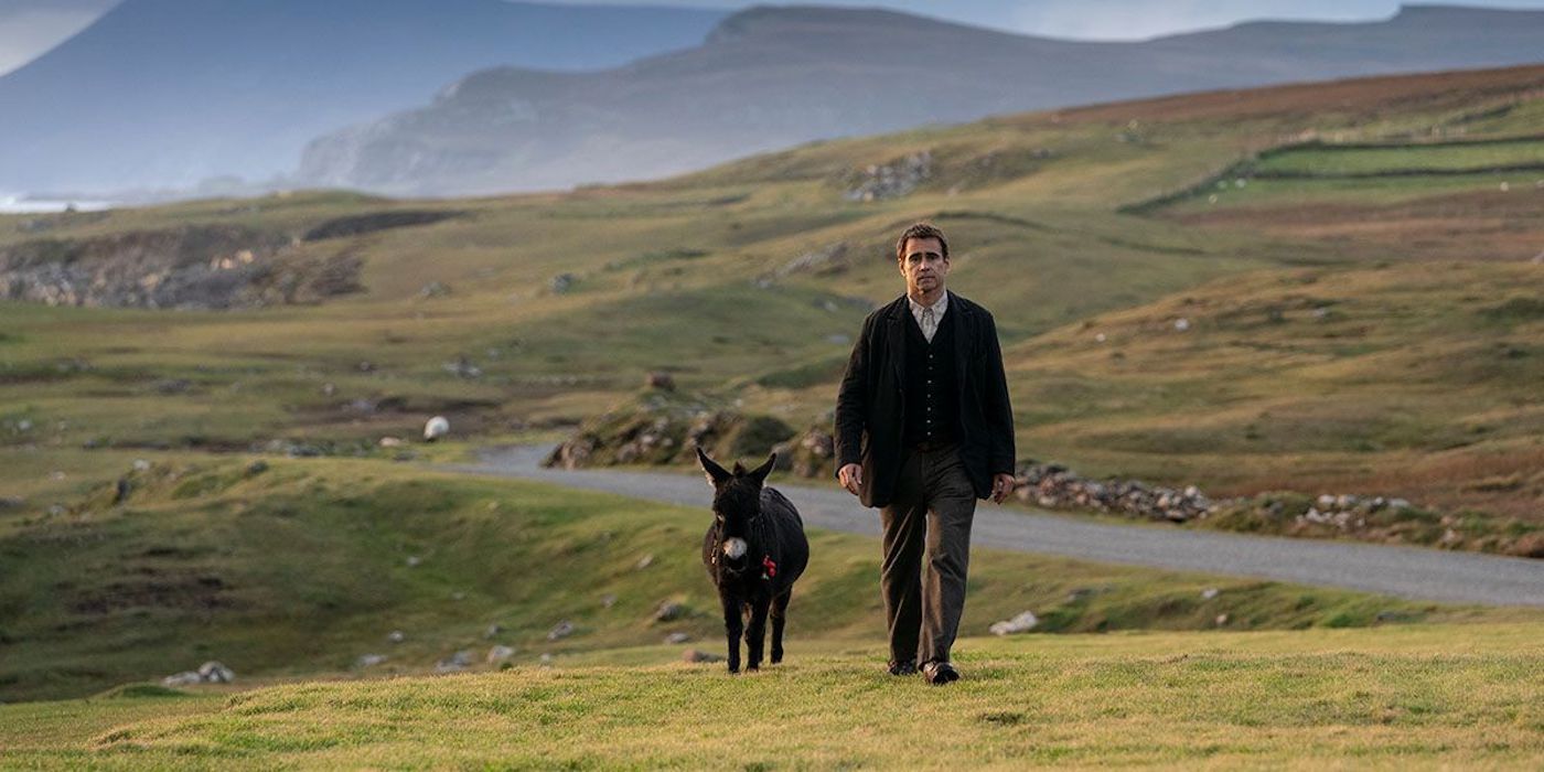 Padraic (Colin Farrell) and a donkey walk across a field in The Banshees Of Inisherin