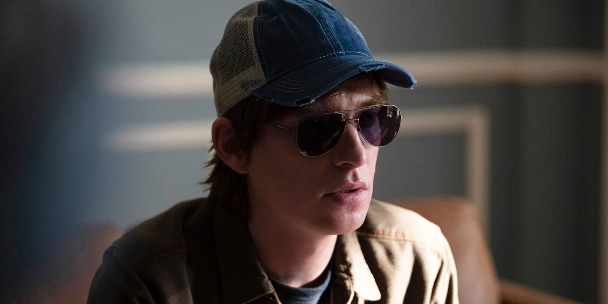 Domhnall Gleeson as Sam, who wears sunglasses and a baseball hat, in The Patient