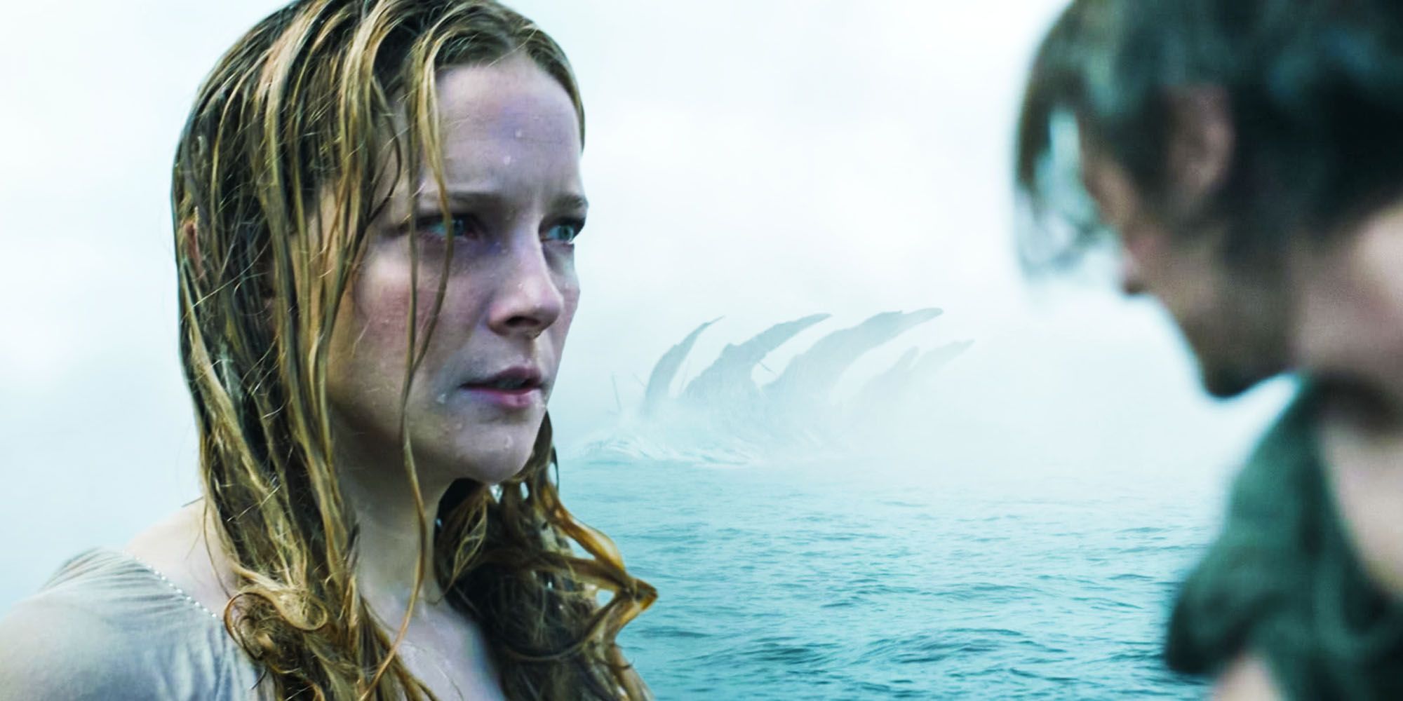 The Lord of The Rings The Rings of Power Galadriel and Halbrand look scared with a sea monster in the background.