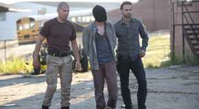 Rick (Andrew Lincoln) and Shane (Jon Bernthal) bringing the abducted Randall (Michael Zegen) with them in The Walking Dead
