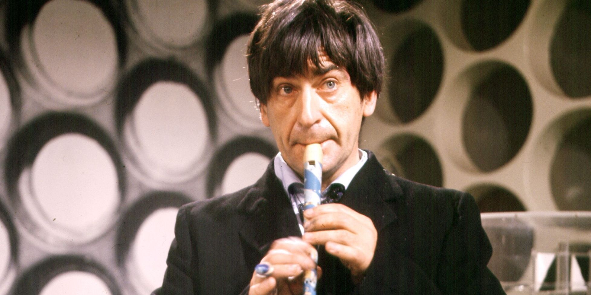 Patrick Troughton as the Second Doctor playing the flute in Doctor Who 