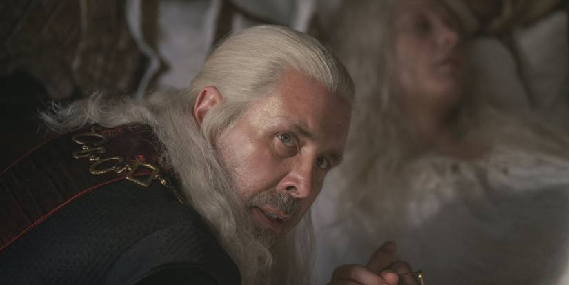 Viserys sits at Aemma's bedside in House of the Dragon