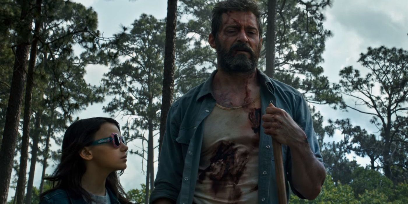 Wolverine in the woods with X-23 in Logan