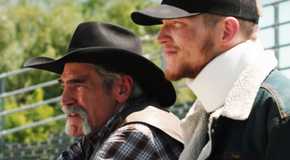 Lloyd sitting with Jimmy who wears a neck brace in Yellowstone