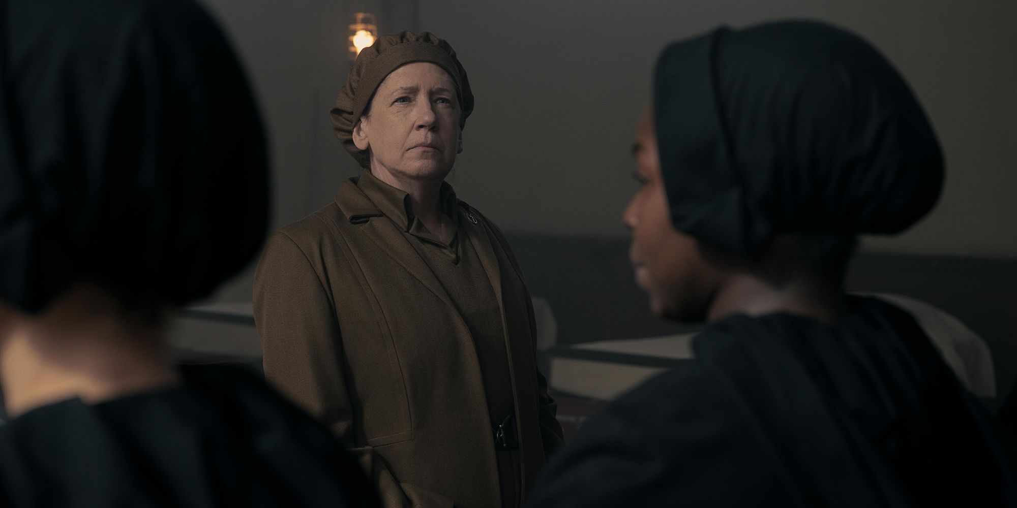 Aunt Lydia from The Handmaid&rsquo;s Tale, looking sternly at handmaids.