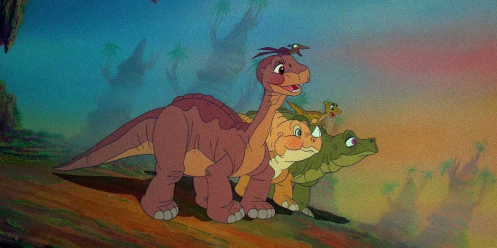 Littlefoot (Gabriel Damon), Ducky (Judith Barsi), Petrie (Will Ryan), and Cera (Candace Houston) looking optimistically in the distance in The Land Before Time