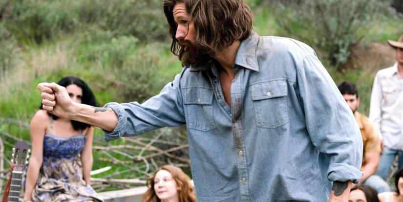 Matt Smith as Charles Manson pointing at someone in Charlie Says