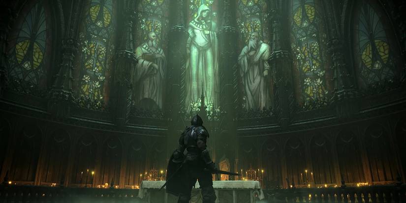 A character looks up in a chapel from Demon's Souls.