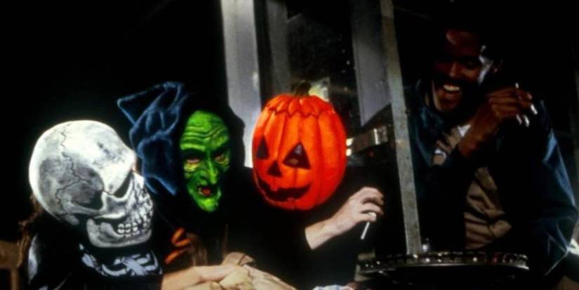 Three children together before Halloween wearing their masks from Silver Shamrock