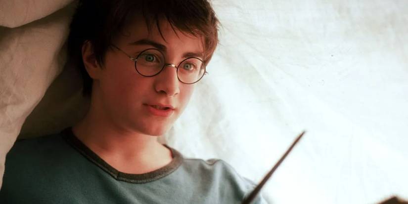 Harry using the Lumos spell in Harry Potter. 