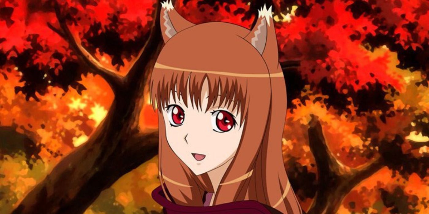 Holo de Spice and Wolf com folhas de outono atrás dela