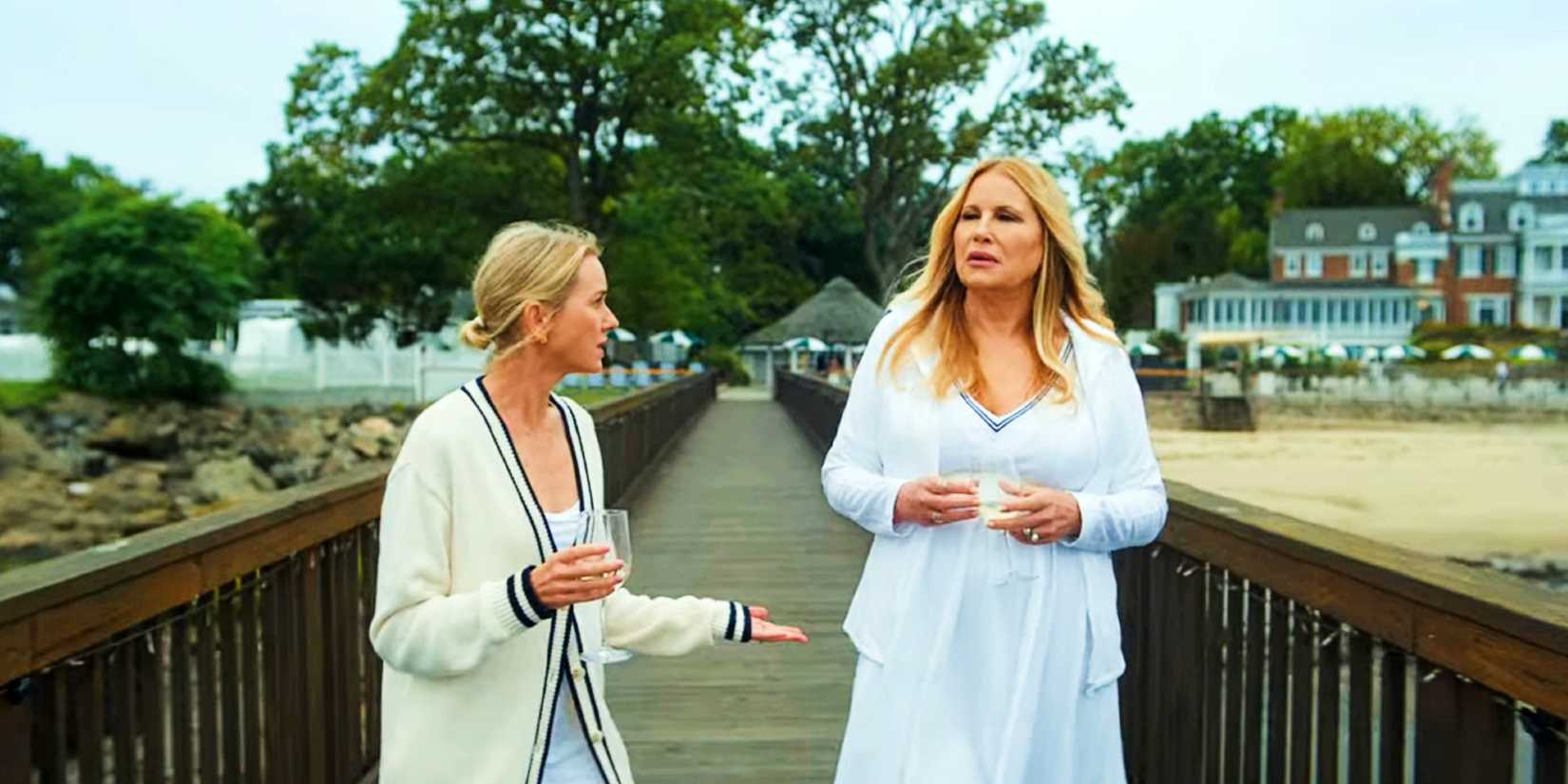 Jennifer Coolidge & Naomi Watts walking on a bridge in The Watcher