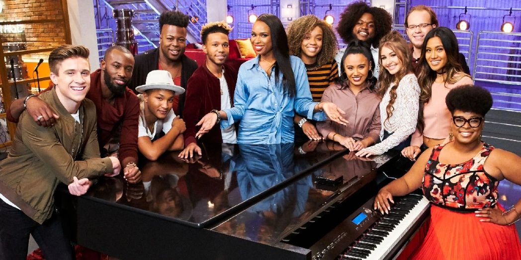 Jennifer Hudson poses with The Voice contestants by a piano