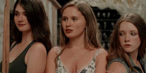 Jodes, Amma and Kelsey standing together in Sharp Objects 