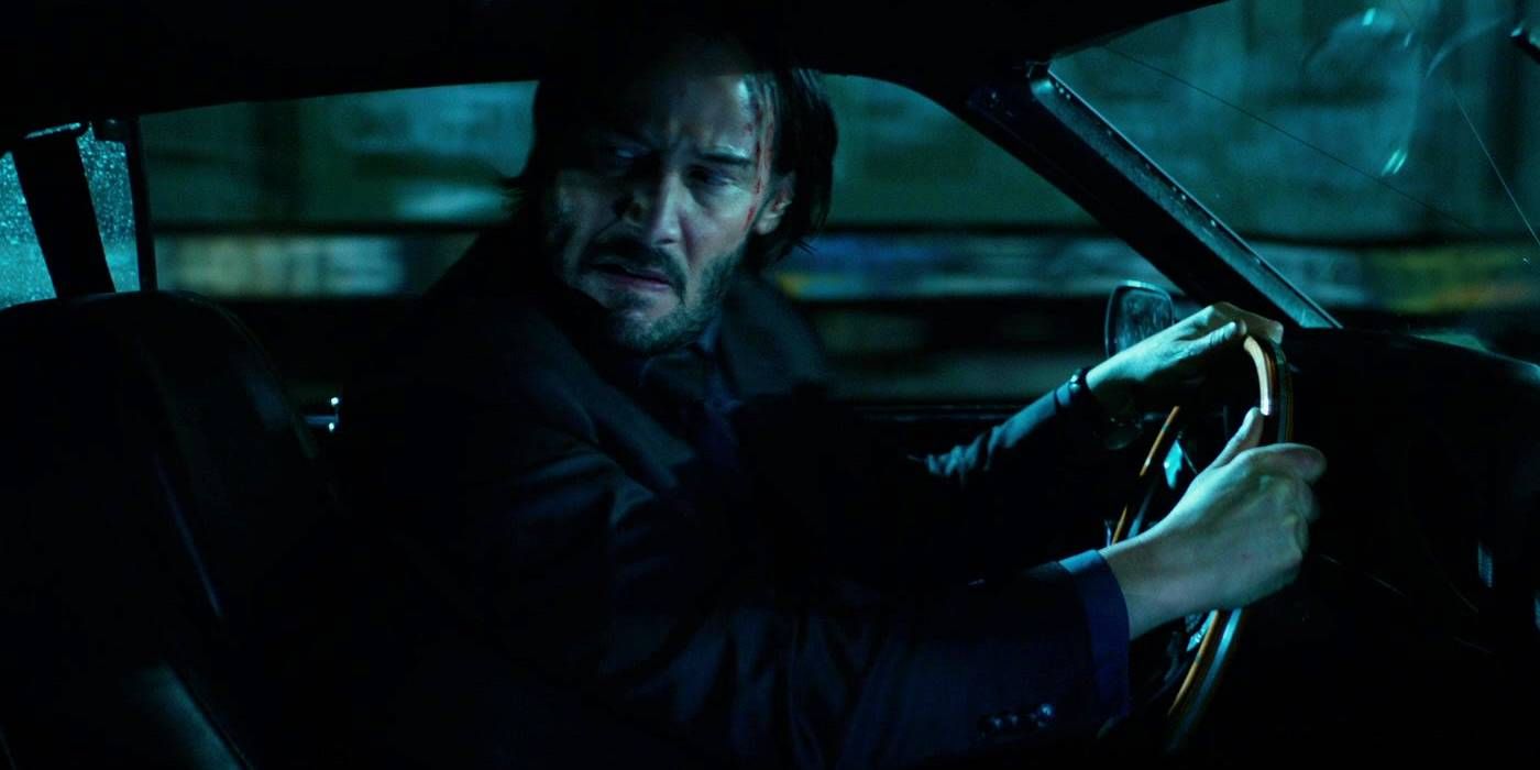 Keanu Reeves as John Wick drives a car in John Wick: Chapter 2.