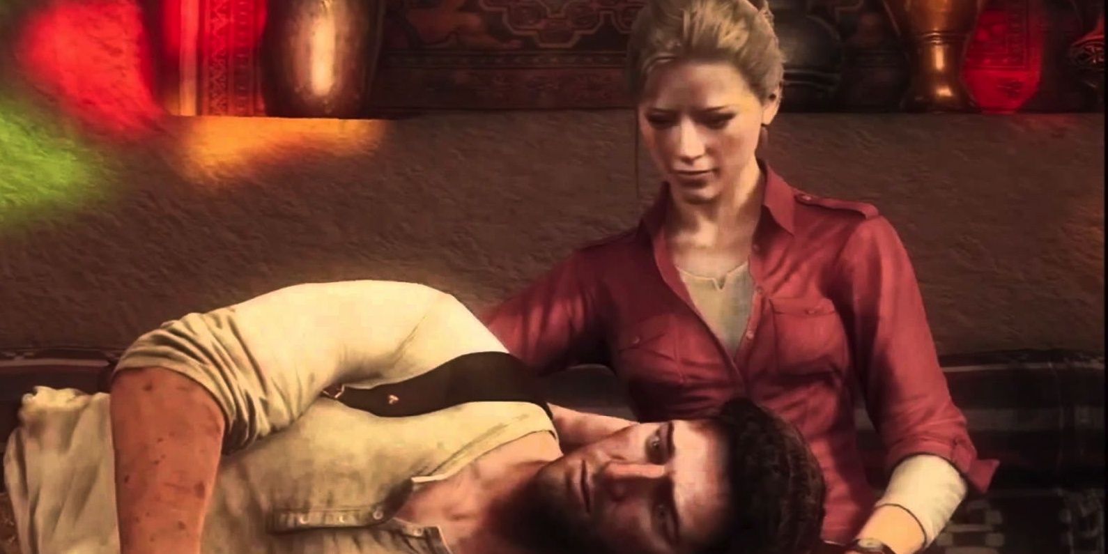 Nate rests his head on Elena's lap in Uncharted 3 