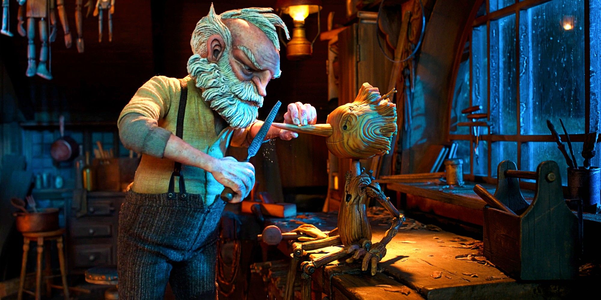 Gepetto making Pinocchio in Guillermo del Toro's Pinocchio