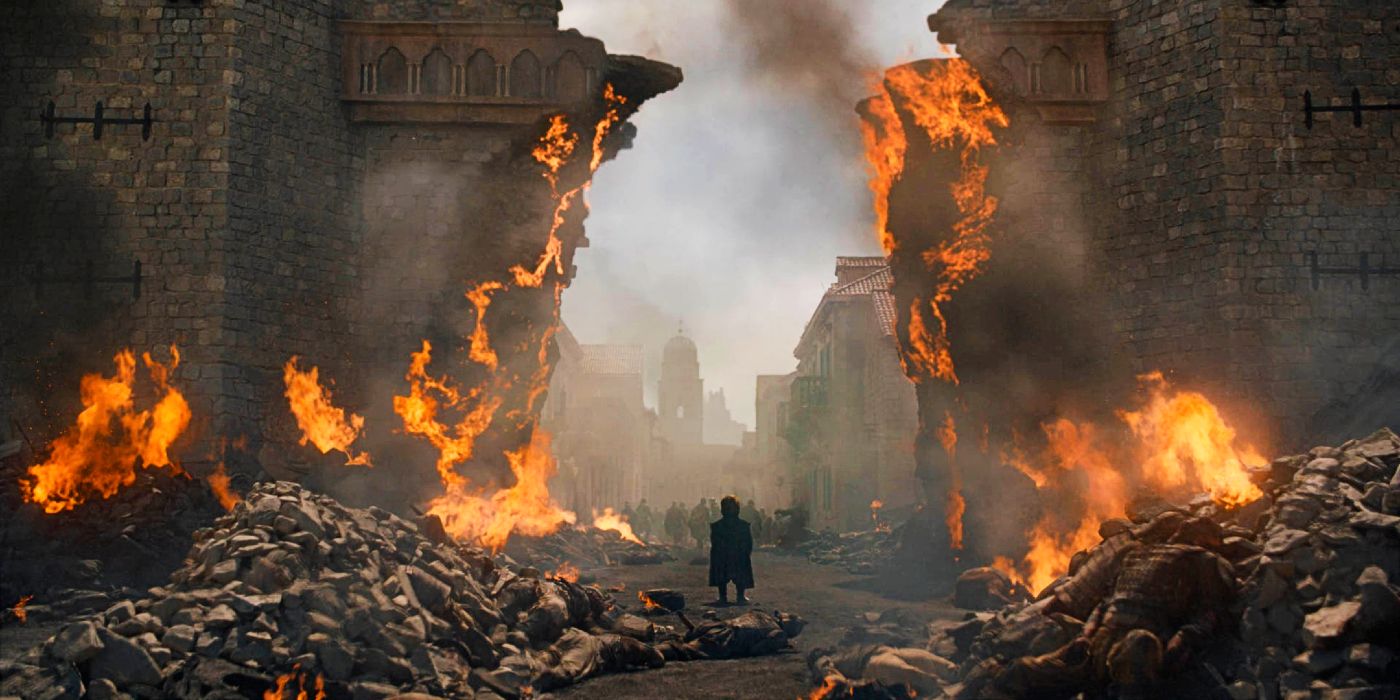 Peter Dinklage as Tyrion Lannister standing amid the ruins of King's Landing in Game of Thrones season 8