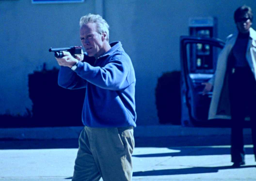 Clint Eastwood as McCaleb shooting a shotgun in Blood Work