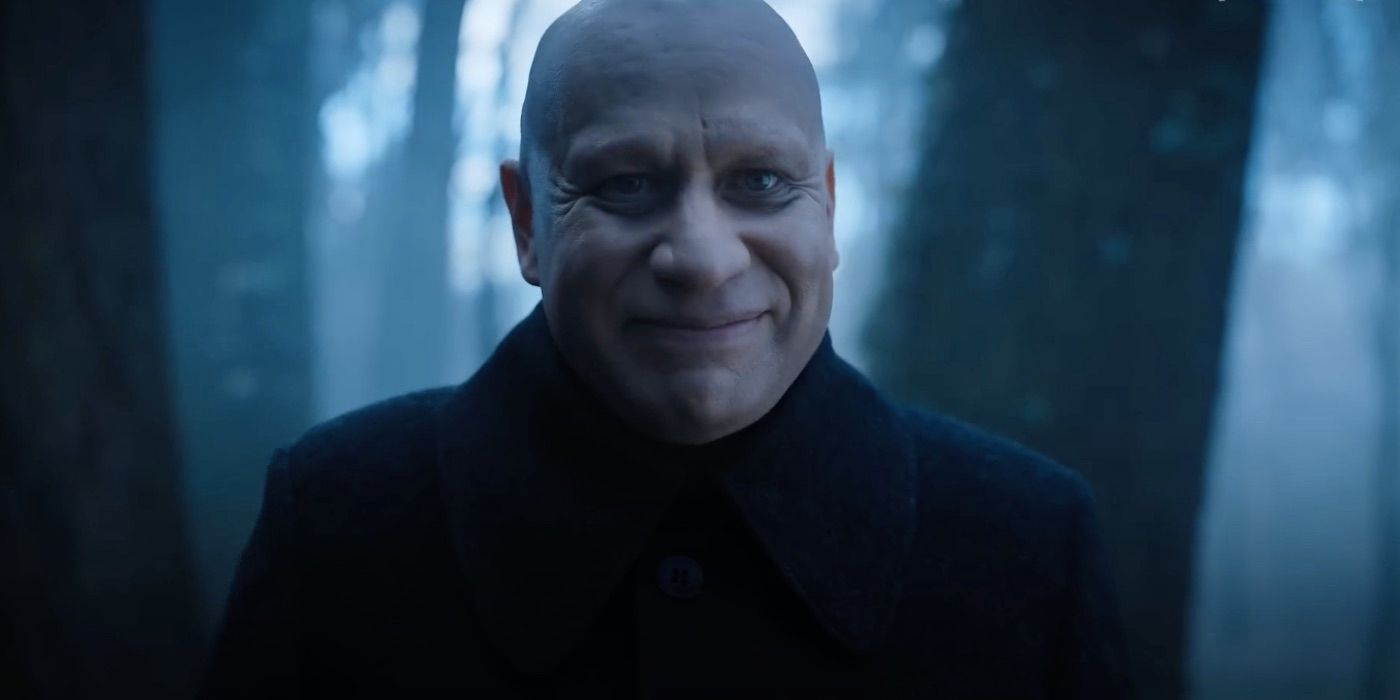 Fred Armisen as Uncle Fester smiling in Wednesday.