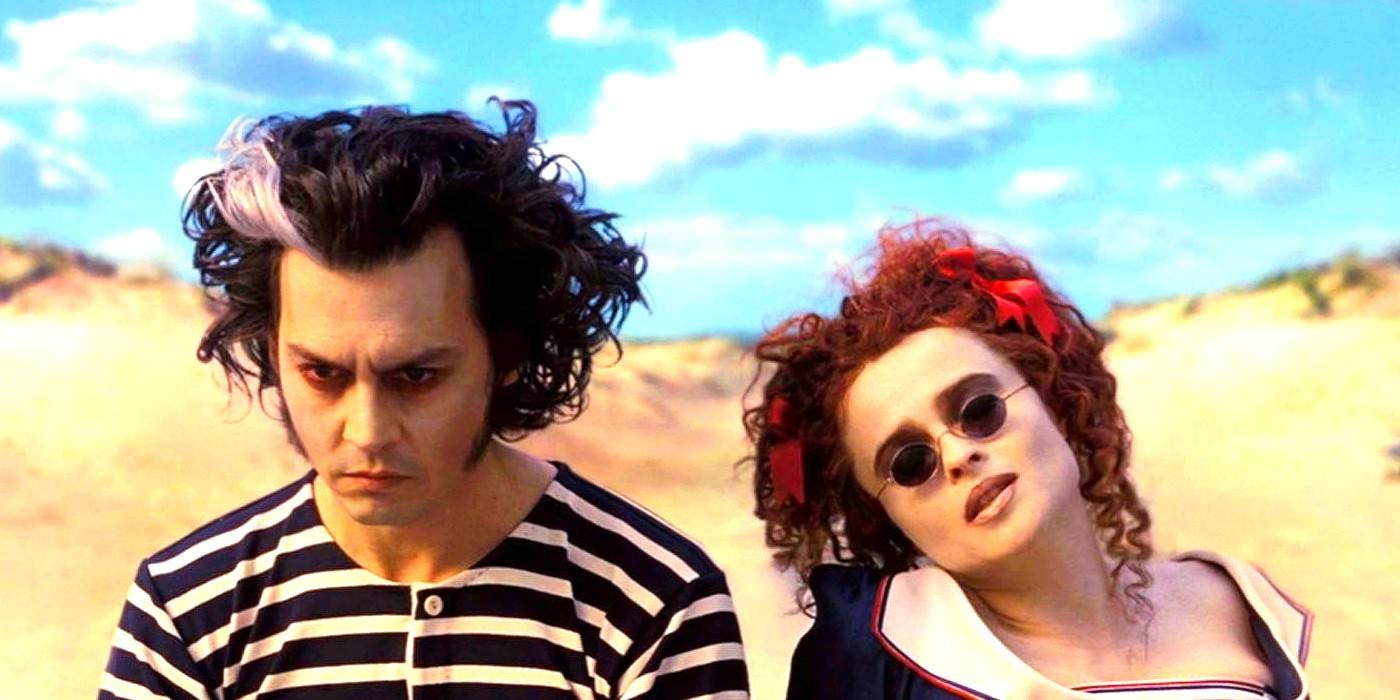 Helena Bonham Carter as Nellie Lovett and Johnny Depp as Sweeney Todd sitting at the beach in Sweeny Todd: The Demon Barber of Fleet Street