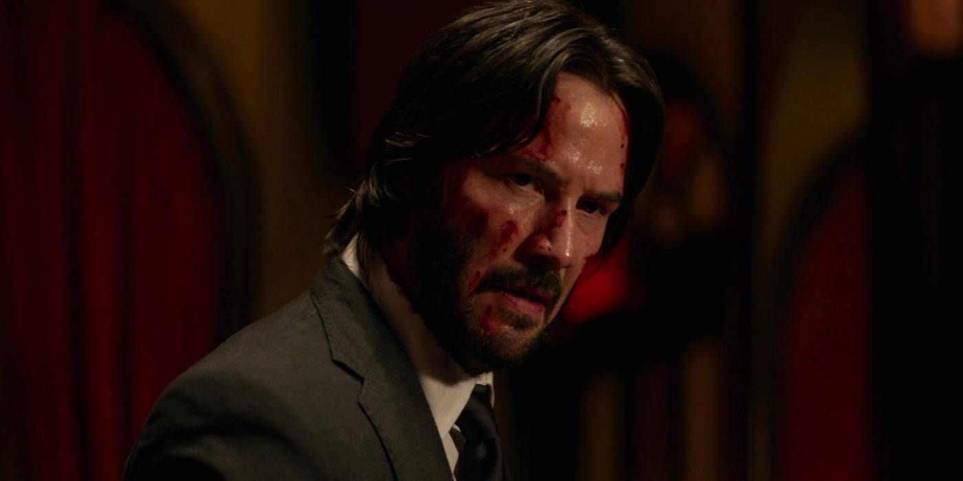 The movie John Wick 2. John wears a dirty white shirt. This is because all his clothes and his washer were burned up when they blew up his house. His dog is