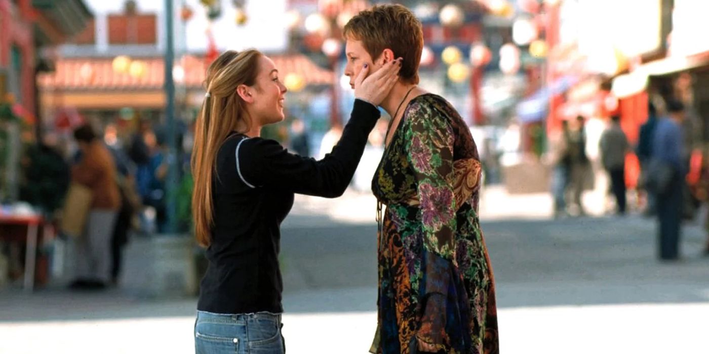 Lindsay Lohan holds Jamie Lee Curtis' head in her hands on the street in Freaky Friday