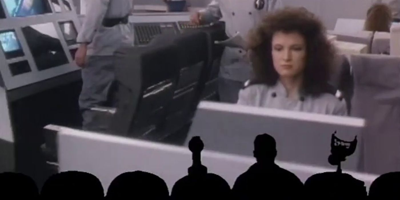 Tom Servo, Mike Nelson, and Crow watching the 1988 movie Space Mutiny.