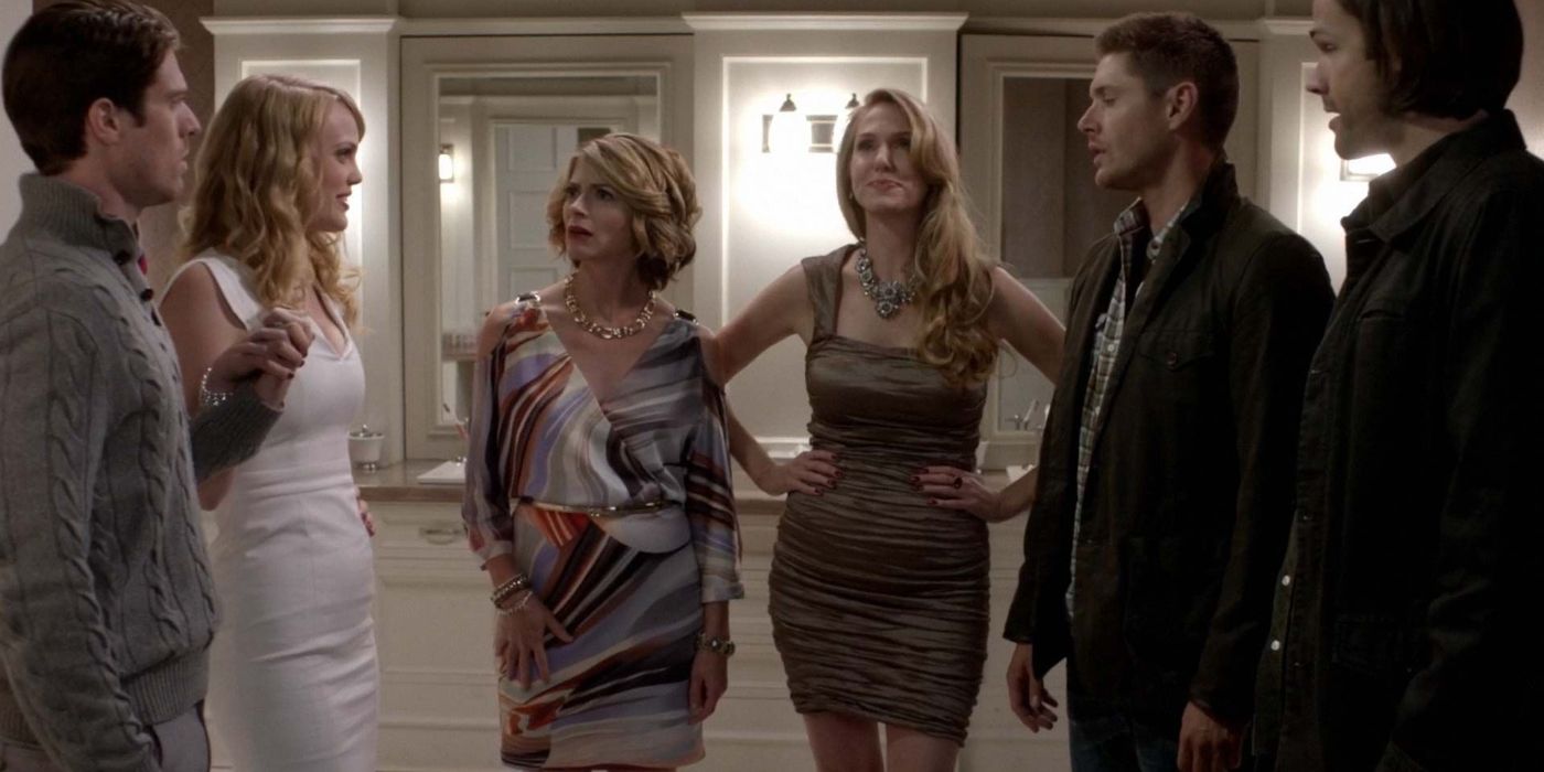 Sam and Dean standing with the LaCroix family in Supernatural