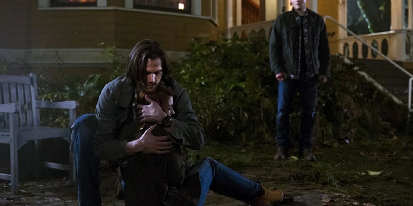 Sam comforting Charlie as Dean stands in the background in Supernatural