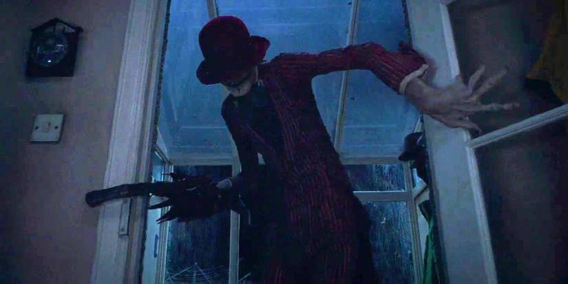 The Crooked Man crawling through a doorway in The Conjuring 2.