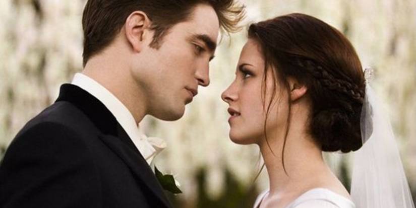 Edward (Robert Pattinson) and Bella (Kristen Stewart) look at each other on their wedding day in Twilight: Breaking Dawn.